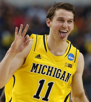 Michigan Wolverines guard Nik Stauskas celebrates scoring over the Florida Gators in their South Regional NCAA men's basketball game in Arlington Michigan Wolverines guard Nik Stauskas celebrates scoring over the Florida Gators in their South Regional NCAA men's basketball game in Arlington